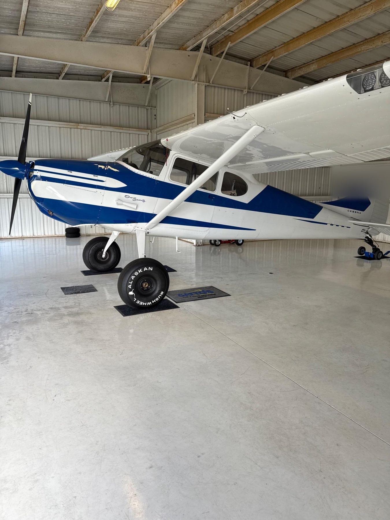 Blue and white Cessna 195 exterior