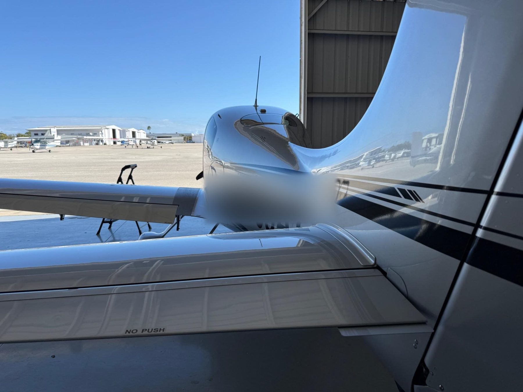 Polished aircraft tail and fuselage, mirror finish
