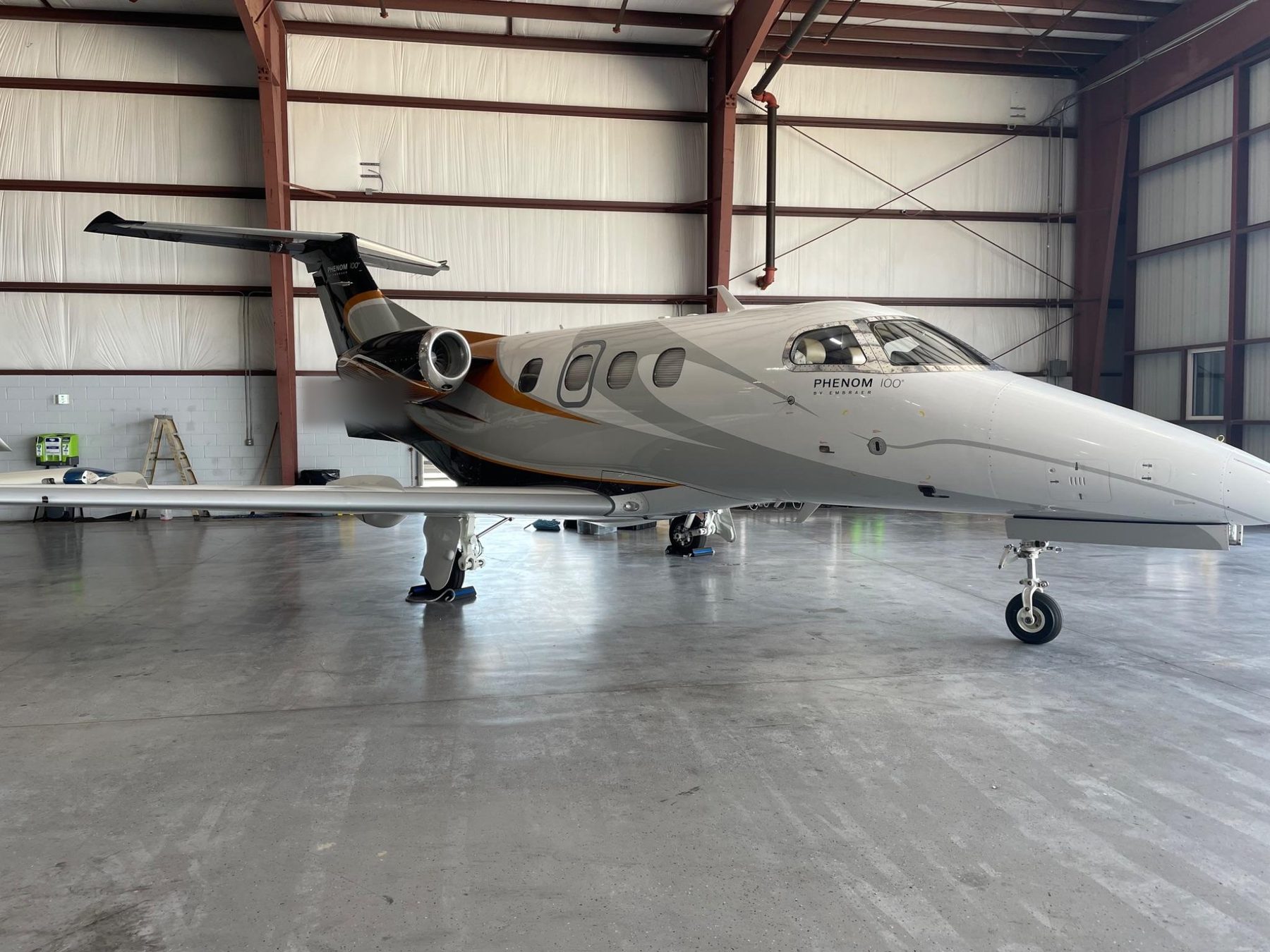 Phenom 100 light jet, full side profile