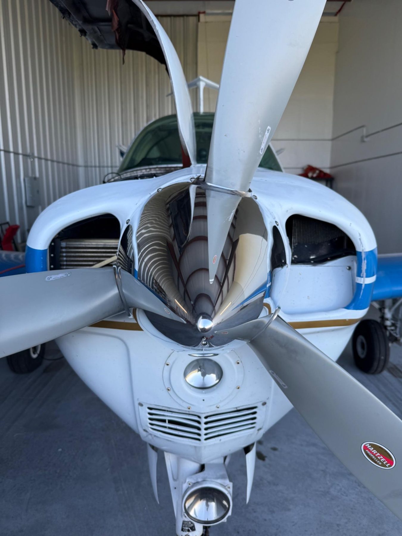 Close-up of polished propeller and engine cowl