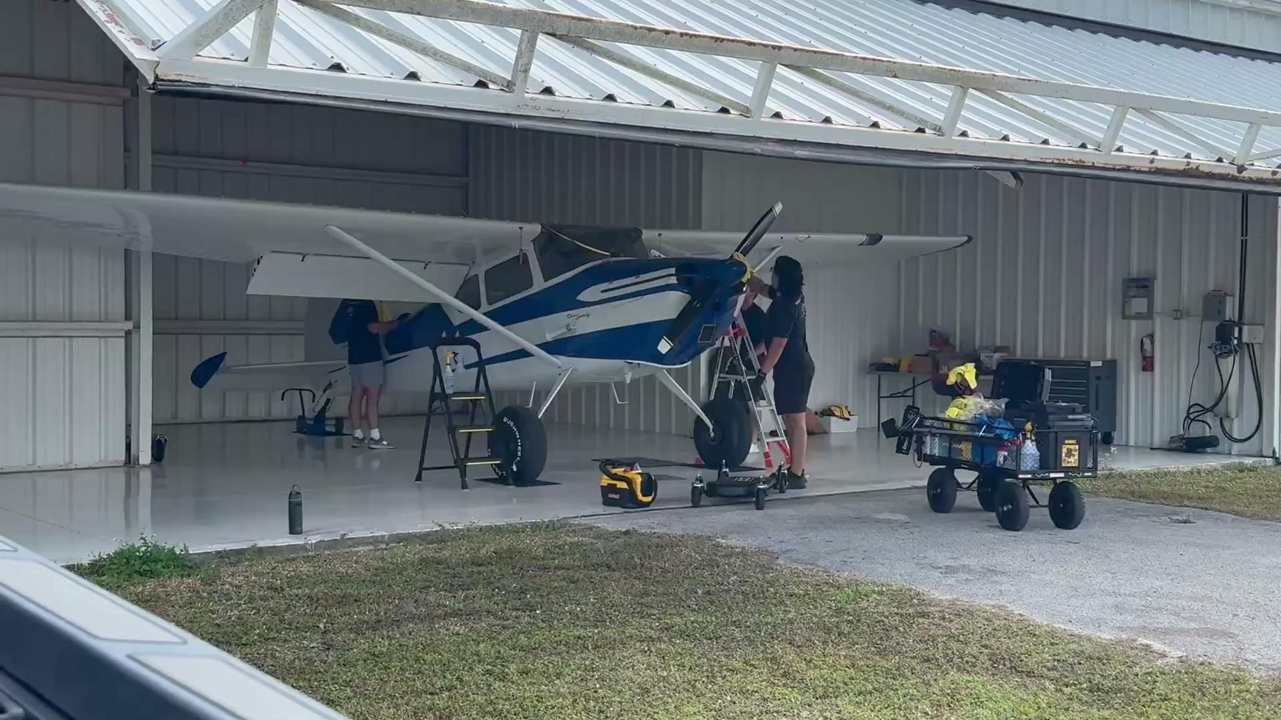 Maverick team servicing a Cessna in an open hangar